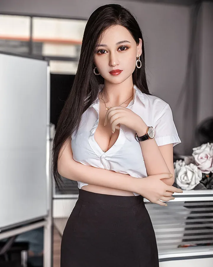 Doll with long dark hair in a white shirt and black pencil skirt, in an office
