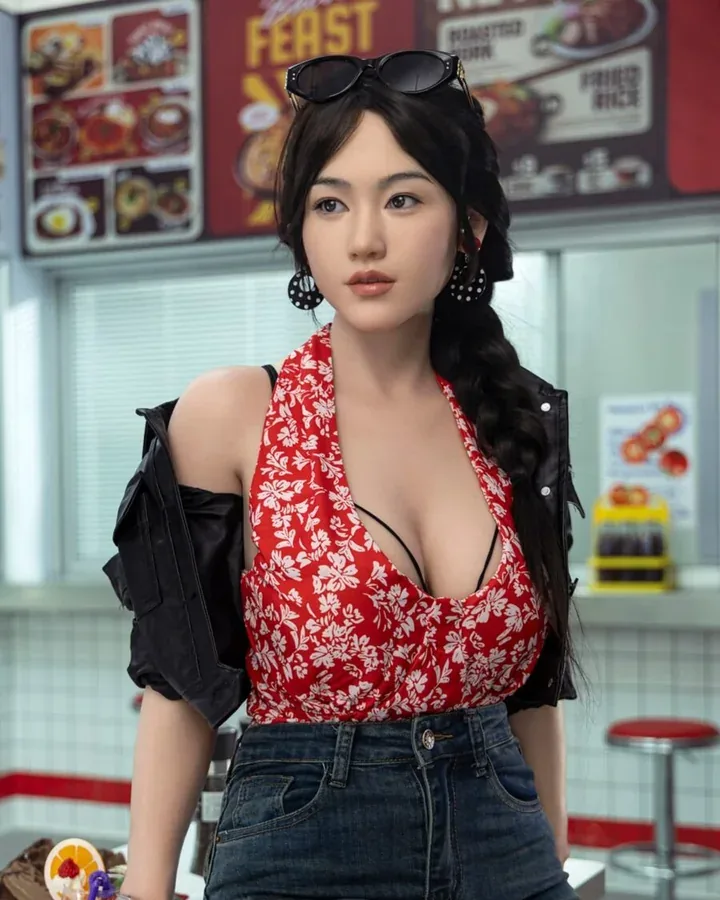 Doll with a long braid in a flower-print halter top, black jacket and jeans